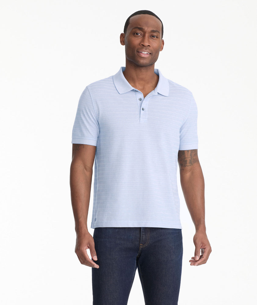 Model is wearing UNTUCKit Lucca polo in eventide.