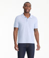 Model is wearing UNTUCKit Lucca polo in eventide.