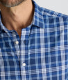 Model is wearing UNTUCKit Performance Mabry Shirt in blue. 