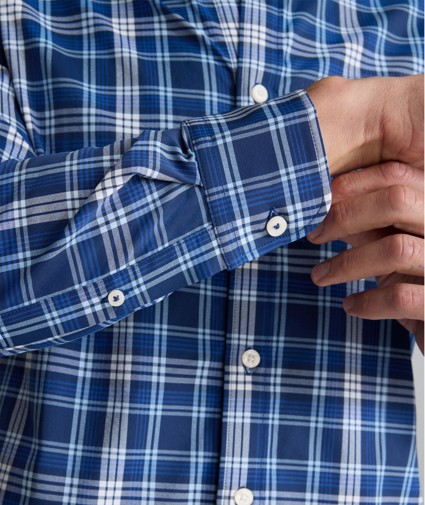Model is wearing UNTUCKit Performance Mabry Shirt in blue. 
