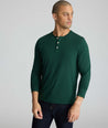 Model wearing a green long-sleeve henley.