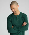 Model wearing a green long-sleeve henley.