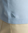 Model wearing a light blue long-sleeve henley.