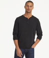 Model is wearing UNTUCKit Marastina henley in black.