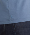 Model is wearing UNTUCKit Marastina henley in blue horizon.