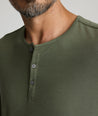 Model is wearing UNTUCKit Marastina LS Tencel Henley in Beetle.