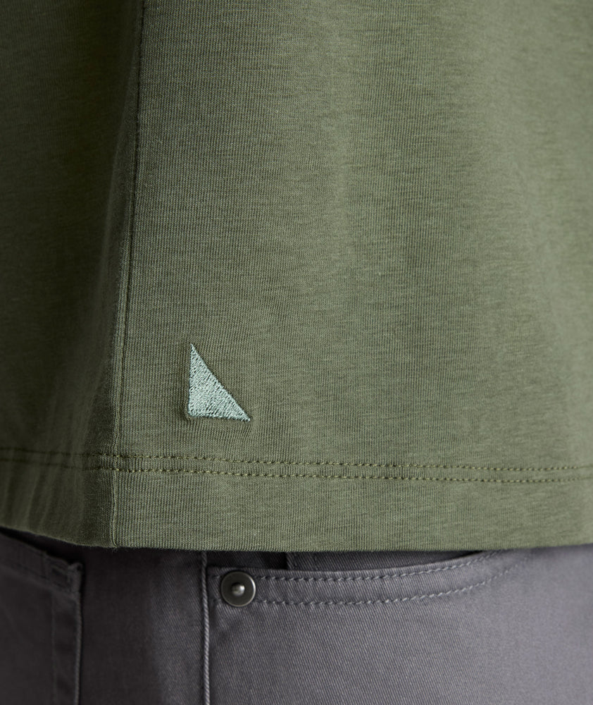 Model is wearing UNTUCKit Marastina LS Tencel Henley in Beetle.