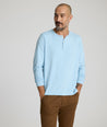 Model is wearing UNTUCKit Marastina LS Tencel Henley in Powder Blue.