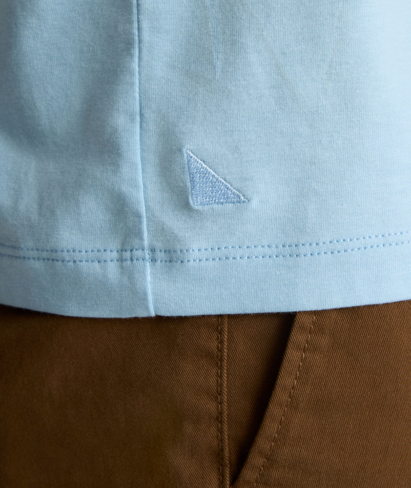 Model is wearing UNTUCKit Marastina LS Tencel Henley in Powder Blue.