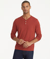 Model is wearing UNTUCKit Marastina henley in Chili Oil.