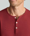 Model is wearing UNTUCKit Marastina henley in Chili Oil.