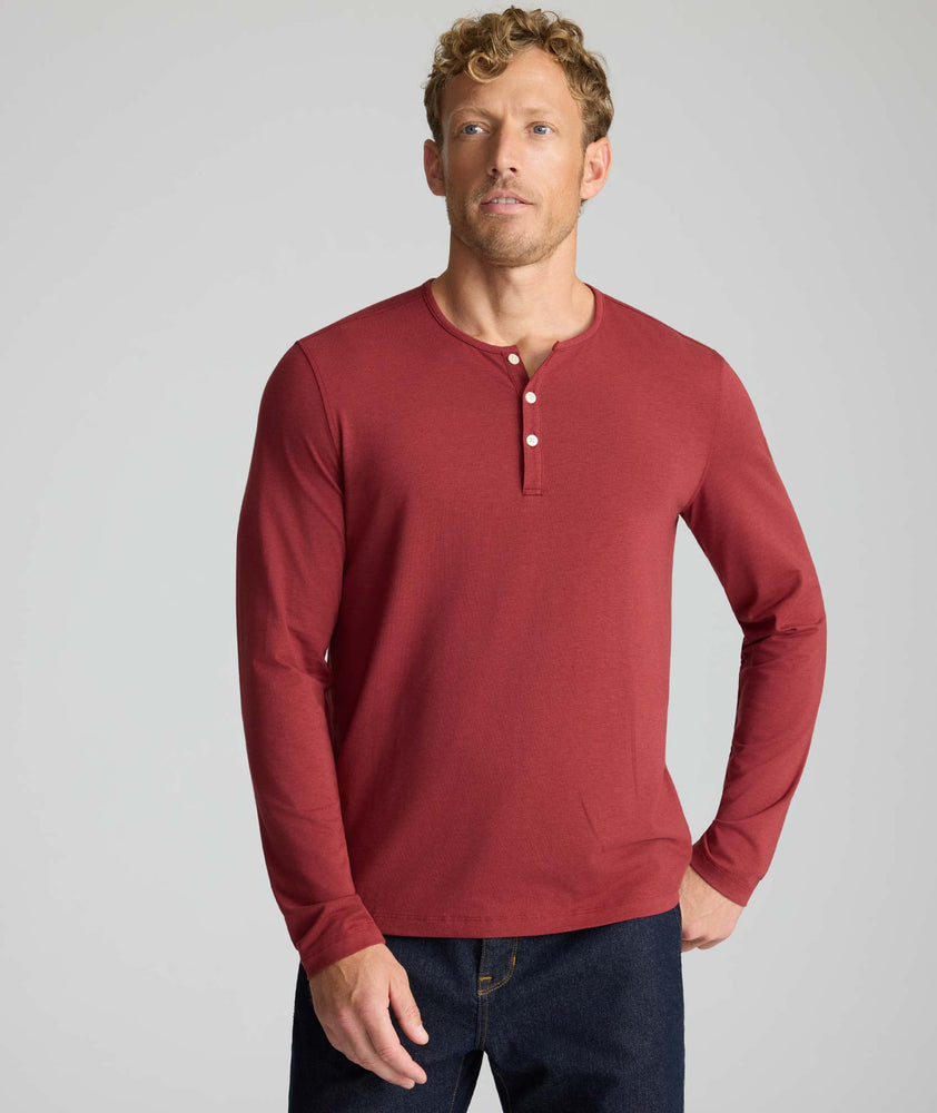 Model is wearing UNTUCKit Marastina henley in Chili Oil.