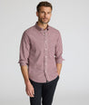 Model wearing a long-sleeve red plaid Wrinkle-Free Shirt.