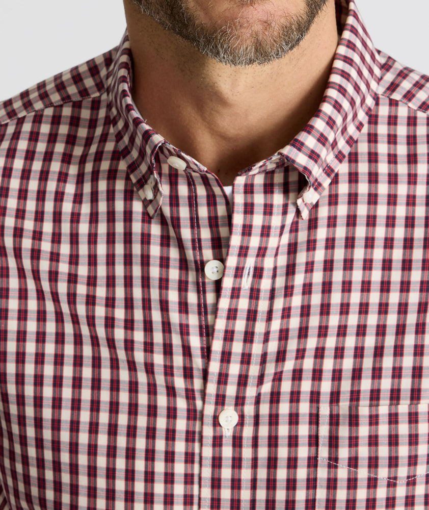 Model is wearing UNTUCKit Wrinkle-Free Marchand Shirt in Black, Red, & White Plaid.
