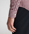 Model is wearing UNTUCKit Wrinkle-Free Marchand Shirt in Black, Red, & White Plaid.