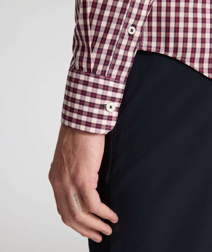 Model wearing a long-sleeve red plaid Wrinkle-Free Shirt.