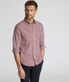 Model wearing a long-sleeve red plaid Wrinkle-Free Shirt.