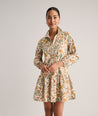 Model is wearing UNTUCKit printed Maren dress.