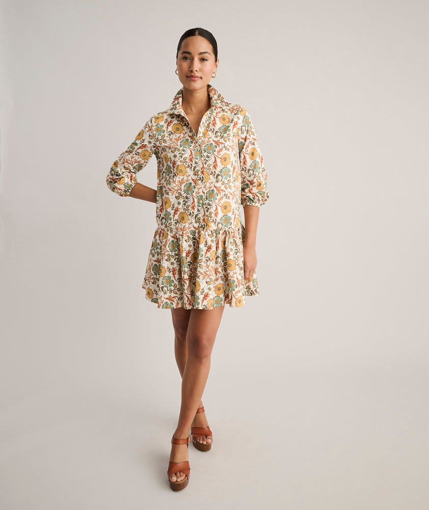 Model is wearing UNTUCKit printed Maren dress.