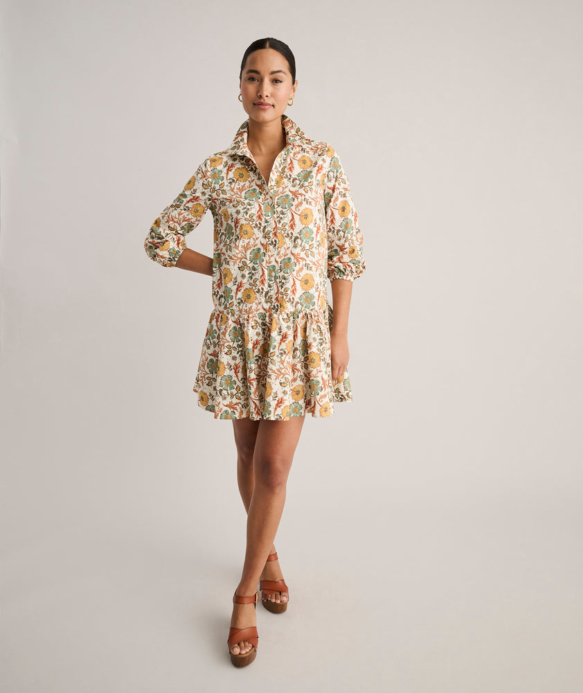 Model is wearing UNTUCKit printed Maren dress.