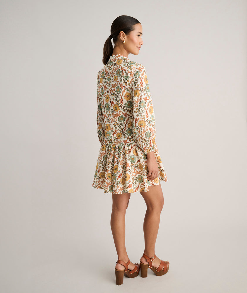 Model is wearing UNTUCKit printed Maren dress.