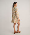 Model is wearing UNTUCKit printed Maren dress.