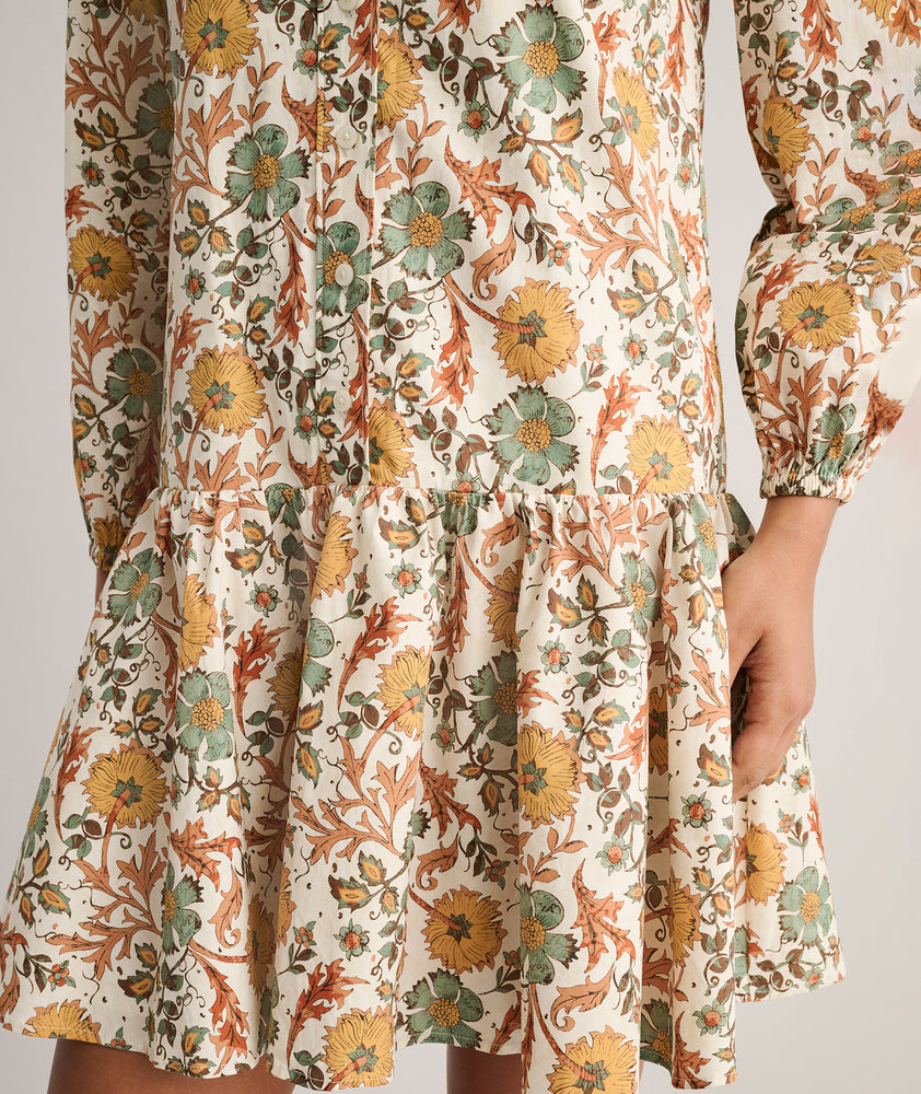 Model is wearing UNTUCKit printed Maren dress.