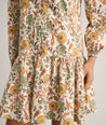 Model is wearing UNTUCKit printed Maren dress.
