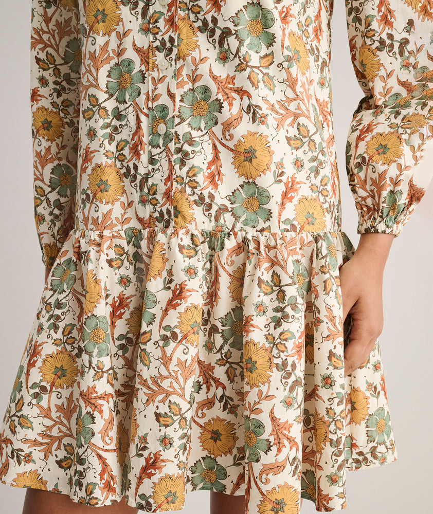Model is wearing UNTUCKit printed Maren dress.
