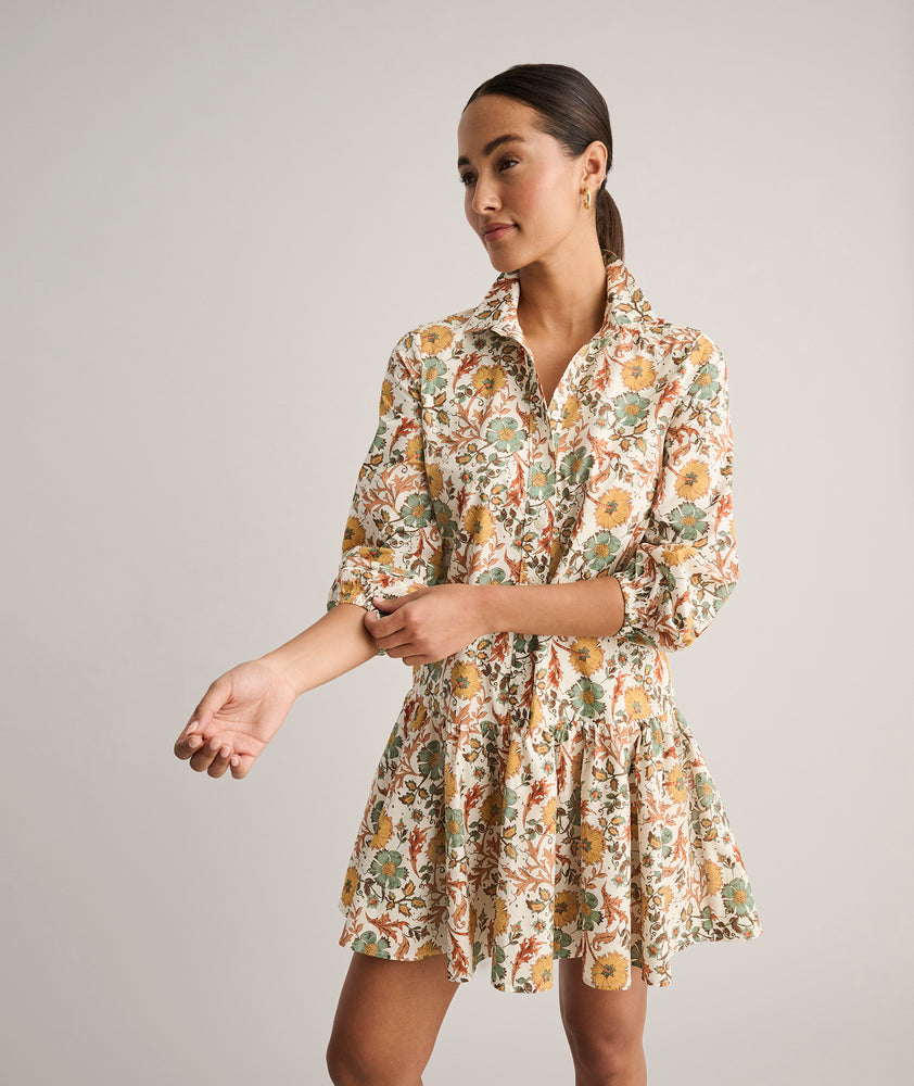 Model is wearing UNTUCKit printed Maren dress.