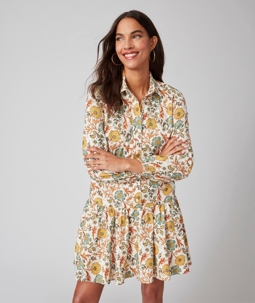 Model is wearing UNTUCKit printed Maren dress.