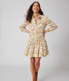 Model is wearing UNTUCKit printed Maren dress.