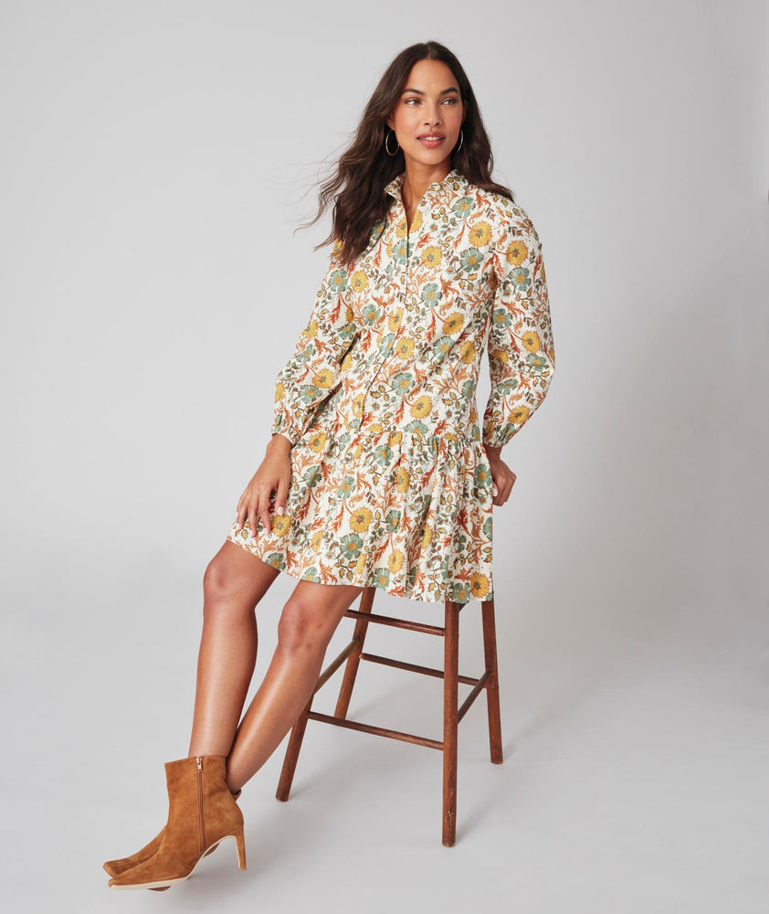 Model is wearing UNTUCKit printed Maren dress.