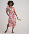 Model is wearing UNTUCKit Marguerite printed orange dress. 