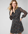 Model is wearing UNTUCKit Marnie dress in floral. 