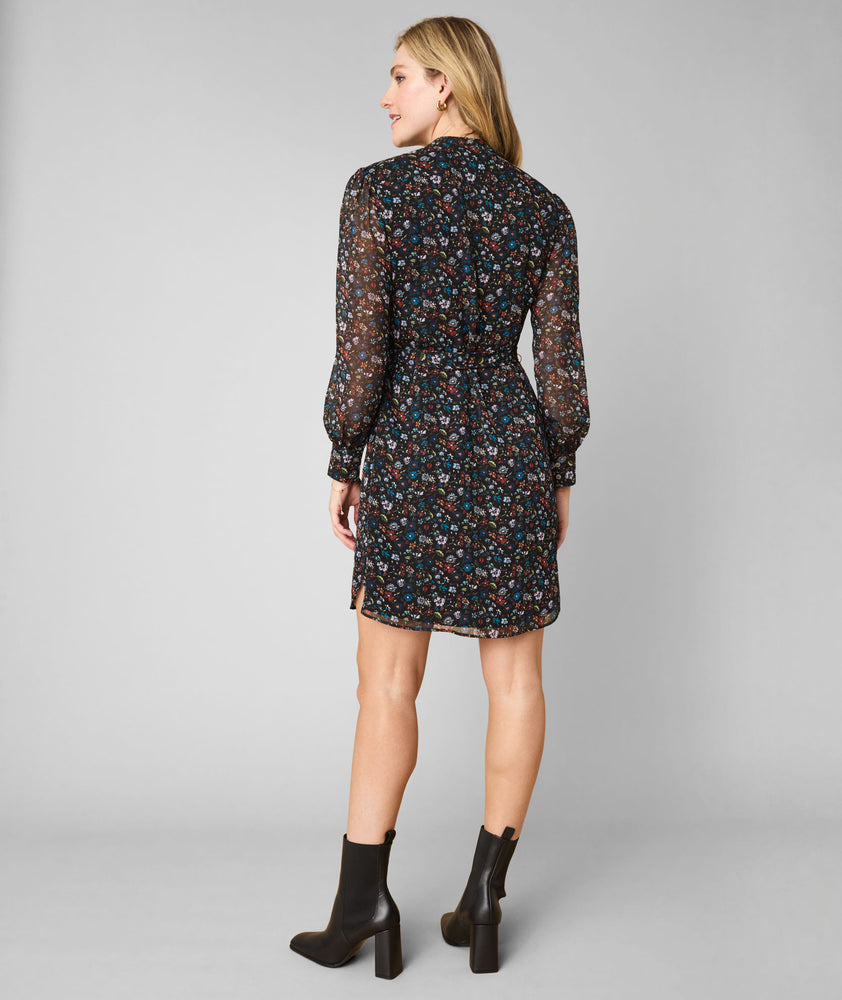 Model is wearing UNTUCKit Marnie dress in floral.