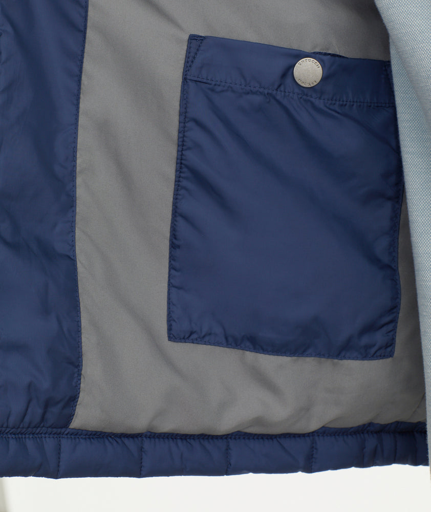 Model is wearing UNTUCKit Marston jacket in Maritime.