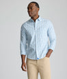 Model is wearing UNTUCKit CottonTek Marten Shirt in blue. 