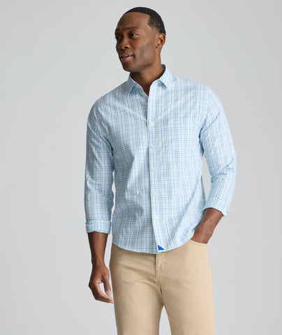 Model is wearing UNTUCKit CottonTek Marten Shirt in blue. 