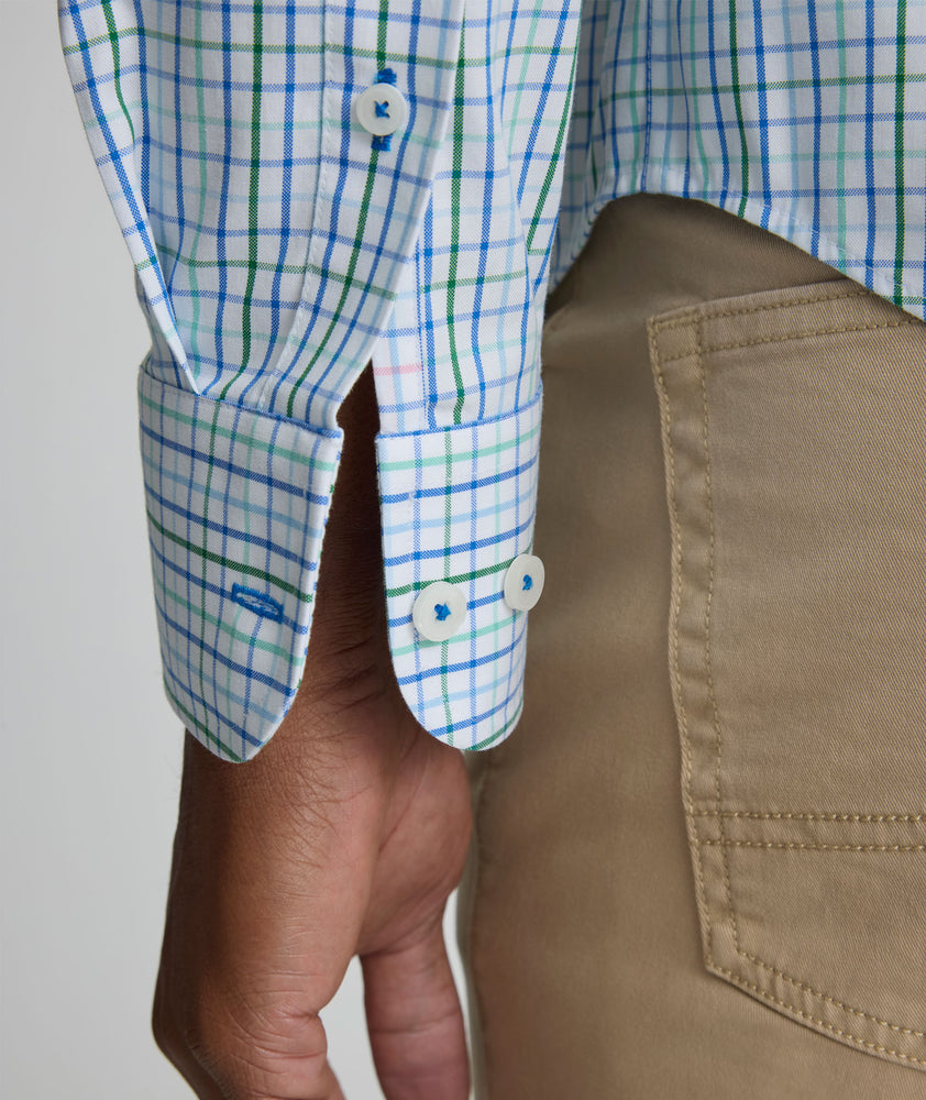 Model is wearing UNTUCKit CottonTek Marten Shirt in blue. 