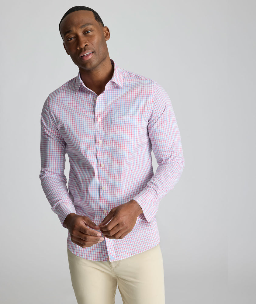 Model is wearing UNTUCKit CottonTek Marten Shirt in pink. 
