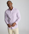 Model is wearing UNTUCKit CottonTek Marten Shirt in pink. 