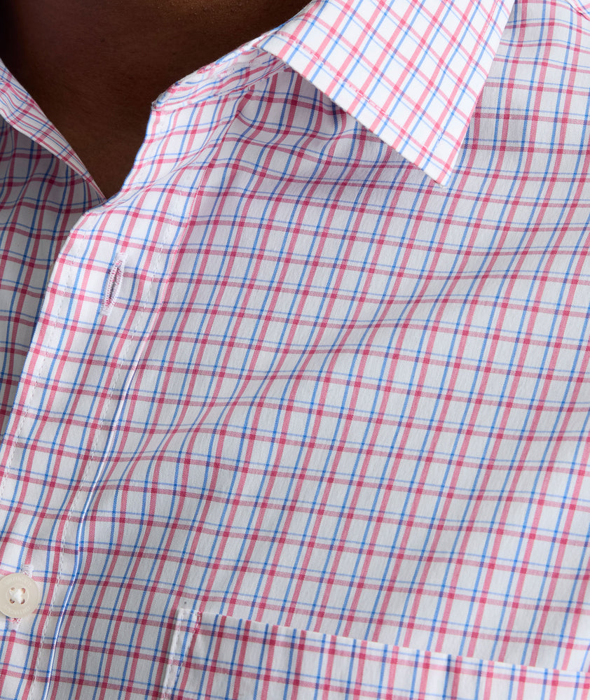 Model is wearing UNTUCKit CottonTek Marten Shirt in pink. 