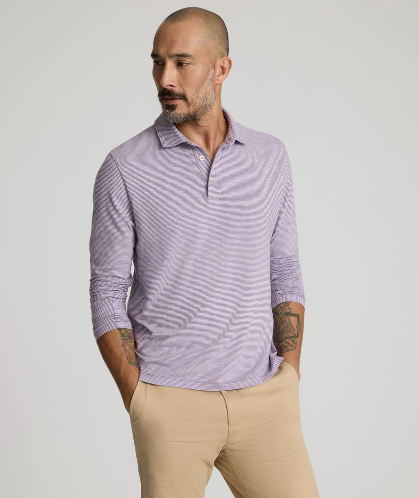 Model is wearing UNTUCKit Martinez Stripe Polo in Montana Grape.