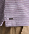 Model is wearing UNTUCKit Martinez Stripe Polo in Montana Grape.