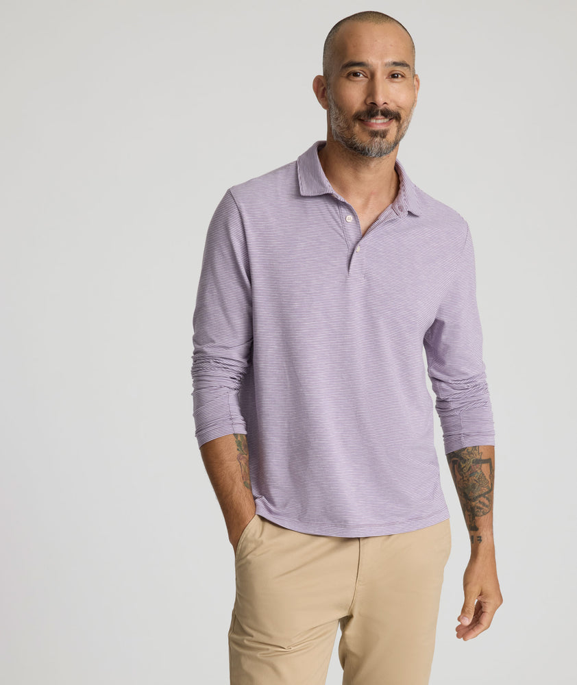 Model is wearing UNTUCKit Martinez Stripe Polo in Montana Grape.