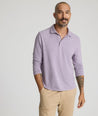 Model is wearing UNTUCKit Martinez Stripe Polo in Montana Grape.