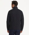 Model is wearing UNTUCKit Marty jacket in black.