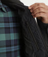Model is wearing UNTUCKit Marty jacket in black.