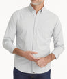 Model is wearing UNTUCKit Wrinkle-Free Performance Maury Shirt in White & Gray Gingham.